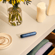 User selecting his daily style: a Solo carry case together with an Navy Blue Augmented Pattern Ploom AURA device.
