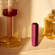 user-pulling-ploom-aura-dark-orchid-device-out-of-drawer